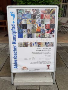 Plakat zur Ausstellung Zeitlos-Mosaikkunst im Wandel